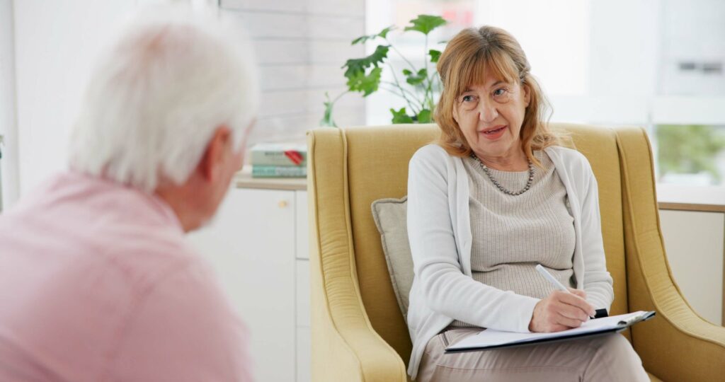 aidant présentant des signes de dépression et consultant un psychologue